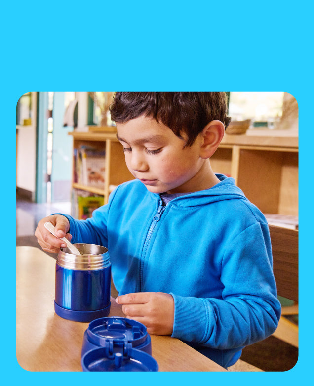 Child with a Thermos FUNtainer food jar.