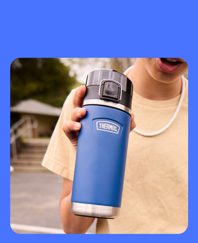 Child holding a Thermos Navy Water Bottle with Spout.