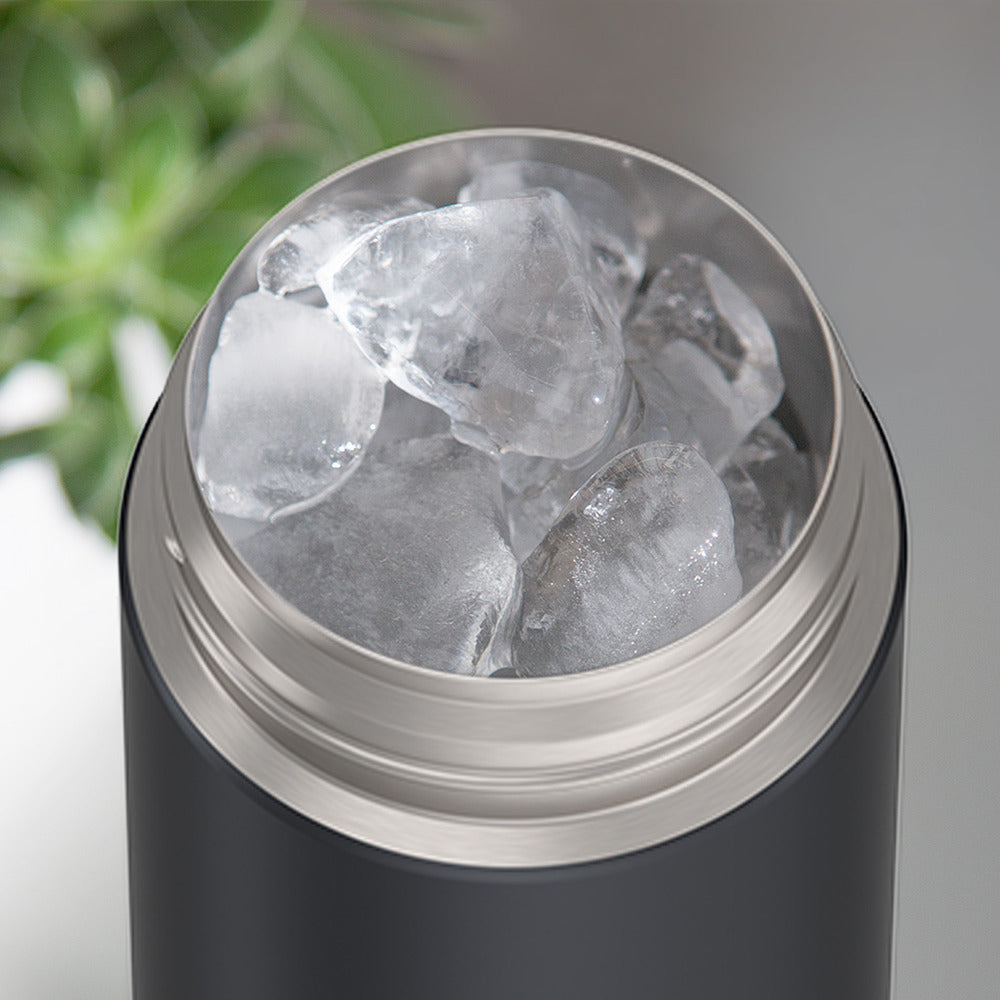 16-ounce Matte Transluscent Charcoal Funtainer water bottle, opened and full of ice.