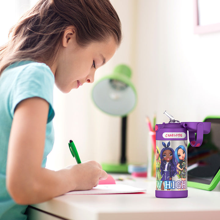 Girl sitting at a table doing homework, with a 12 ounce Rainbow High, Purple Funtainer water bottle opened next to her.