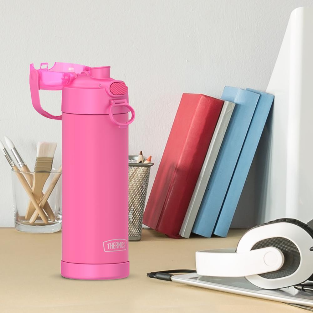 16-ounce Funtainer Stainless Steel Water Bottle with Spout and locking lid, Neon Pink, side view, lid open, sitting on a table.