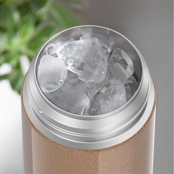 12 ounce Iridescent Rose Gold Funtainer water bottle, opened and full of ice.