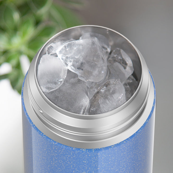 12 ounce Periwinkle Glitter Funtainer water bottle, opened and full of ice.